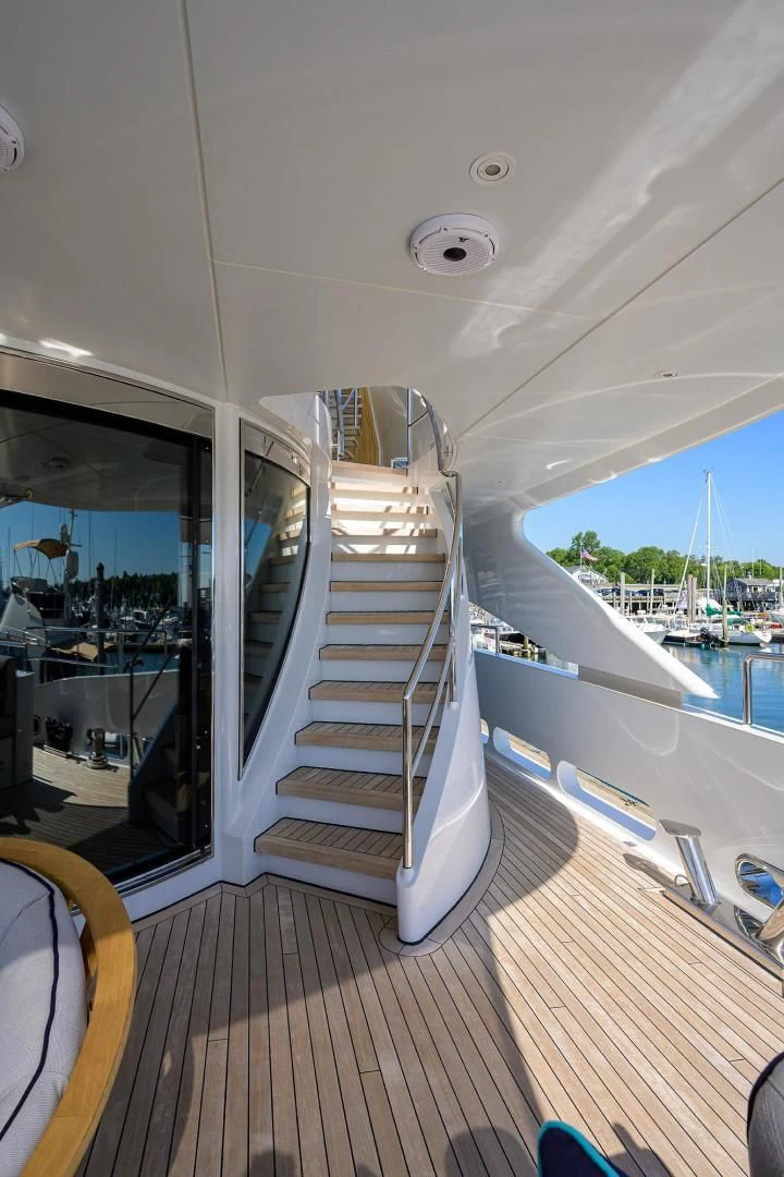 a staircase leading to a balcony aboard SHARKFINN Yacht for Sale