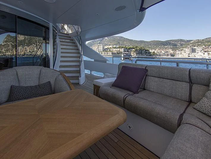 a couch and a table on a boat aboard SHARKFINN Yacht for Sale