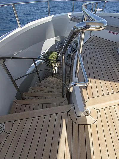 a white boat on a deck aboard SHARKFINN Yacht for Sale
