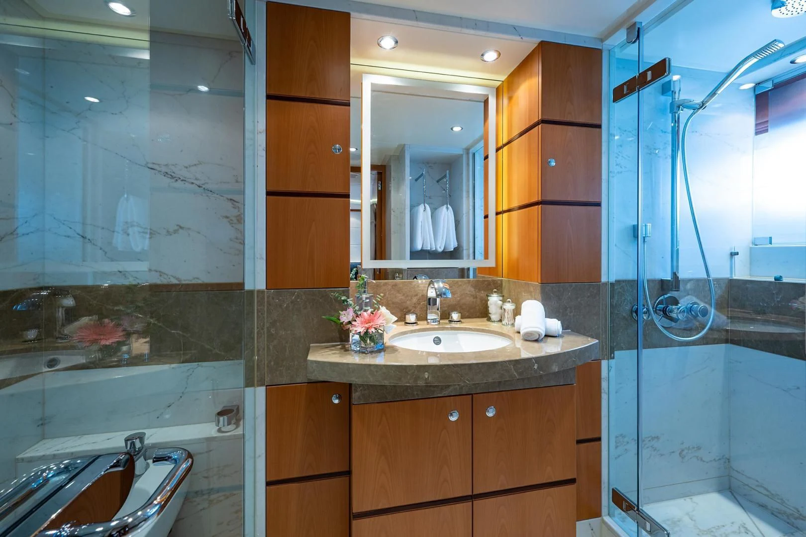 a bathroom with a glass shower aboard SHARKFINN Yacht for Sale