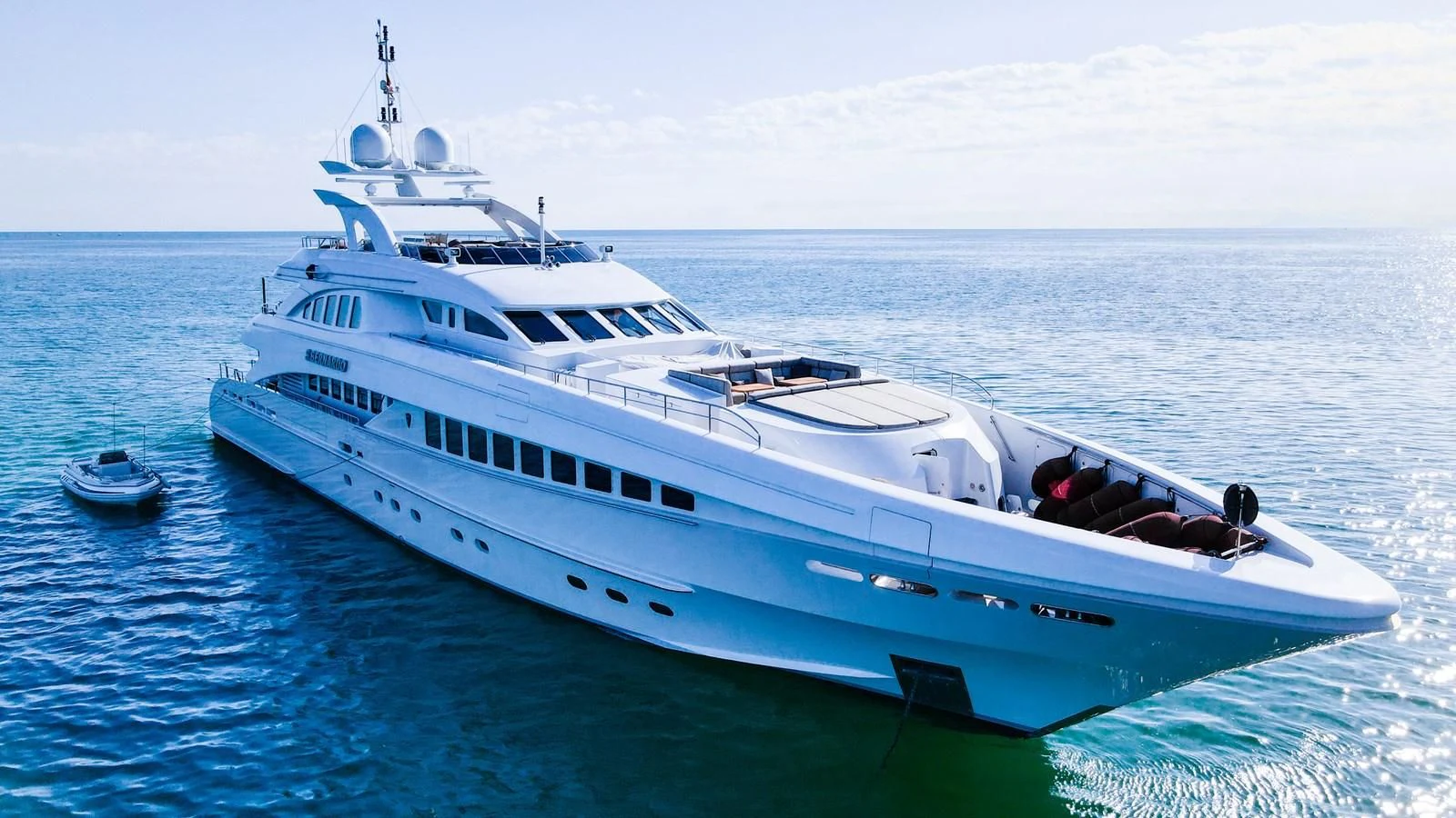 a white yacht in the water aboard SHARKFINN Yacht for Sale
