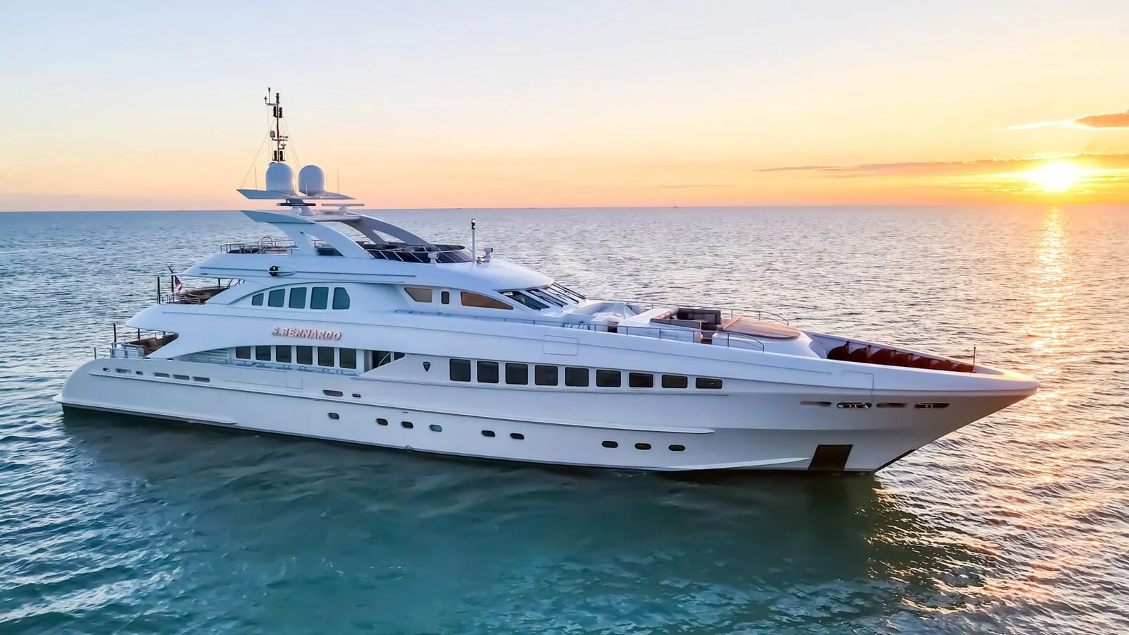 a white yacht in the water aboard SHARKFINN Yacht for Sale