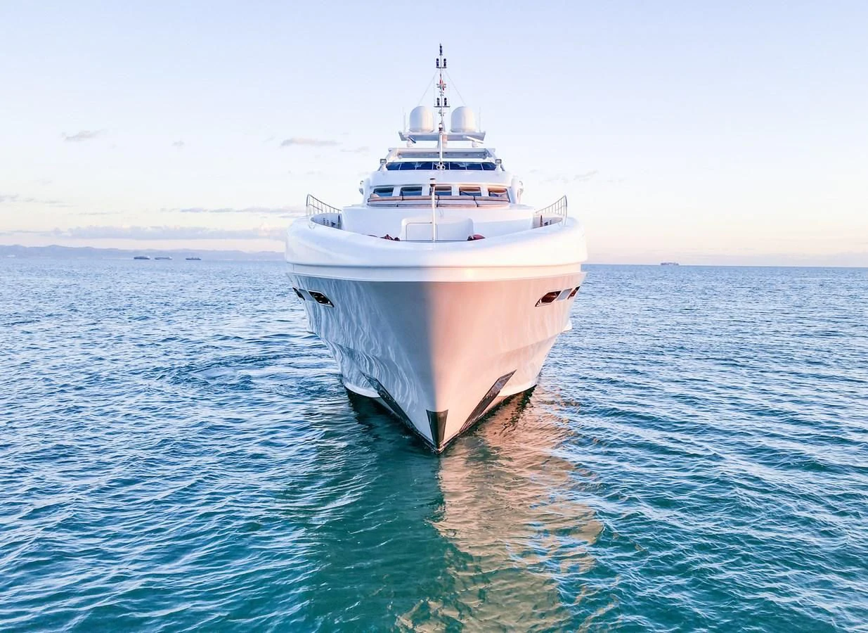 a large white boat in the water aboard SHARKFINN Yacht for Sale