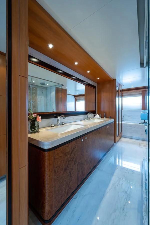 a bathroom with a large mirror aboard SHARKFINN Yacht for Sale