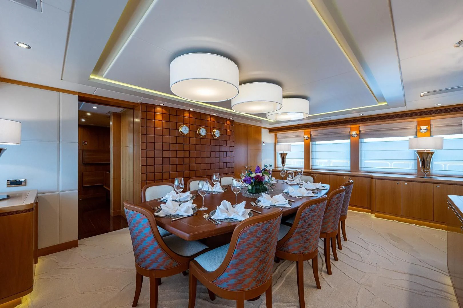 a dining room with a table and chairs aboard SHARKFINN Yacht for Sale
