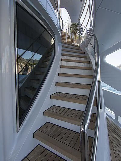 a white staircase with a glass window aboard SHARKFINN Yacht for Sale
