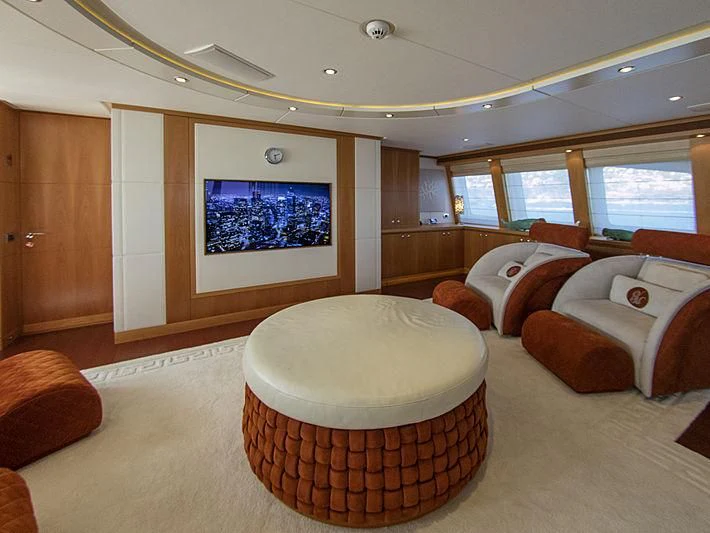 a room with a couch and a table aboard SHARKFINN Yacht for Sale