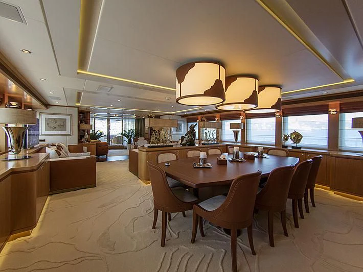 a large room with a table and chairs aboard SHARKFINN Yacht for Sale