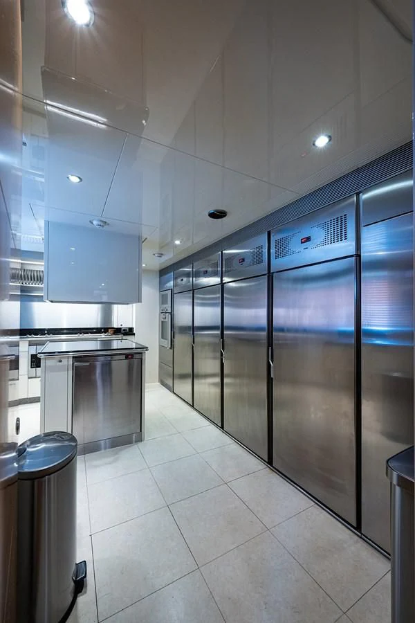 a large kitchen with glass doors aboard SHARKFINN Yacht for Sale