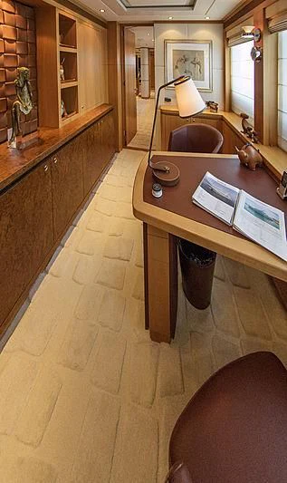 a room with a table and chairs aboard SHARKFINN Yacht for Sale