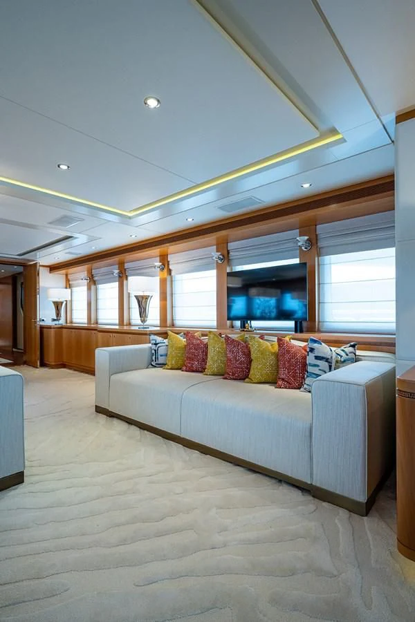 a large living room with a large window aboard SHARKFINN Yacht for Sale