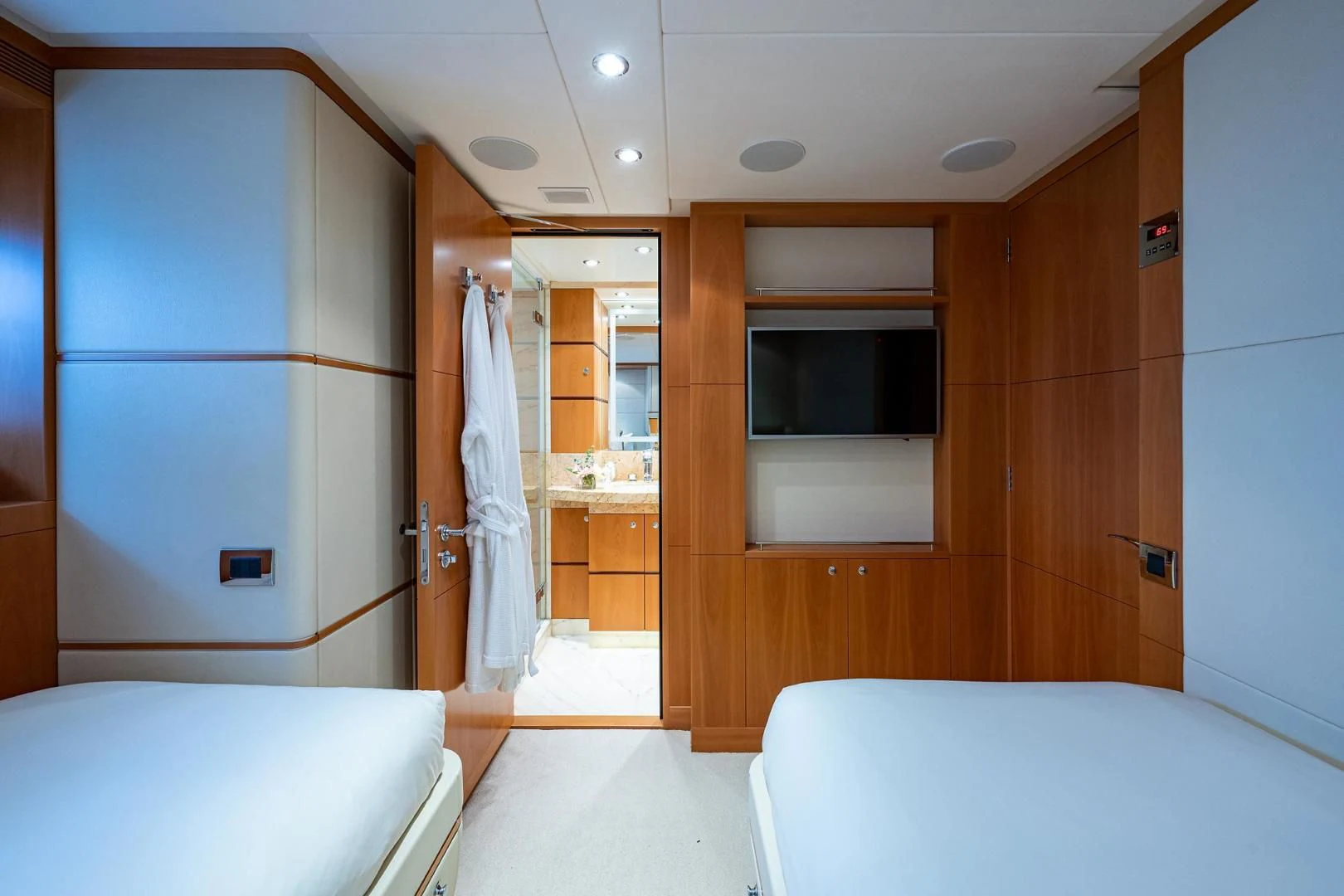 a room with a bed and a closet aboard SHARKFINN Yacht for Sale