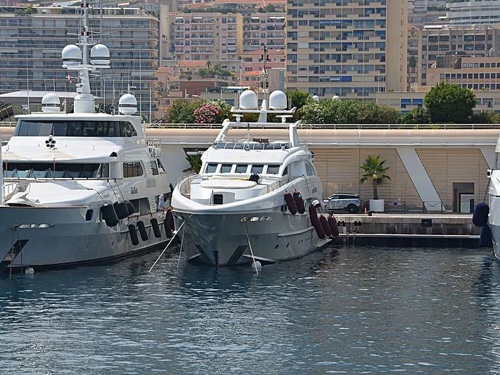 boats docked at a pier aboard SHARKFINN Yacht for Sale