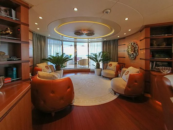 a living room with a large window aboard SHARKFINN Yacht for Sale