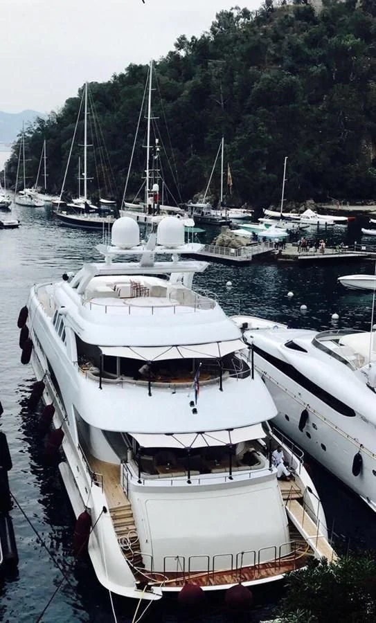 a group of boats are parked in a harbor aboard SHARKFINN Yacht for Sale