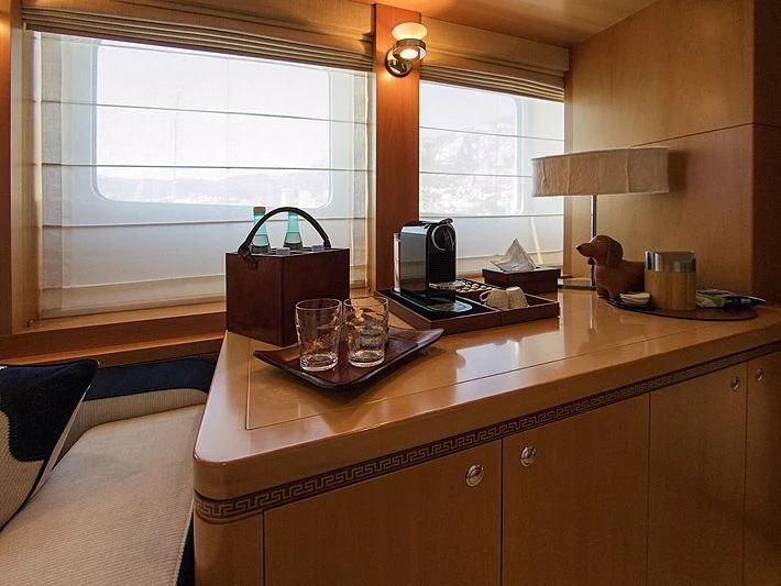 a kitchen with a table and a window aboard SHARKFINN Yacht for Sale