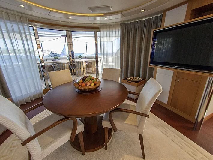 a table and chairs in a room aboard SHARKFINN Yacht for Sale