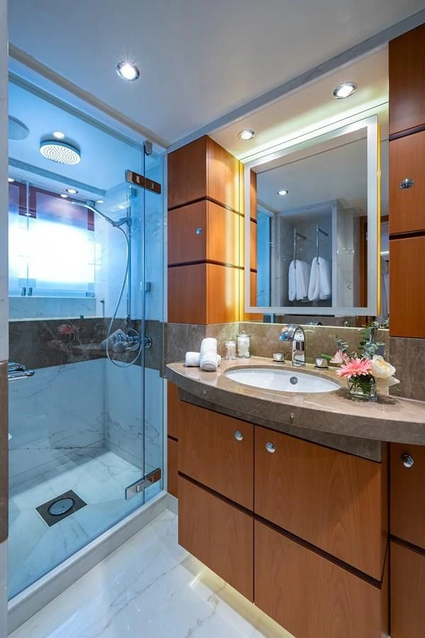 a bathroom with a large mirror aboard SHARKFINN Yacht for Sale