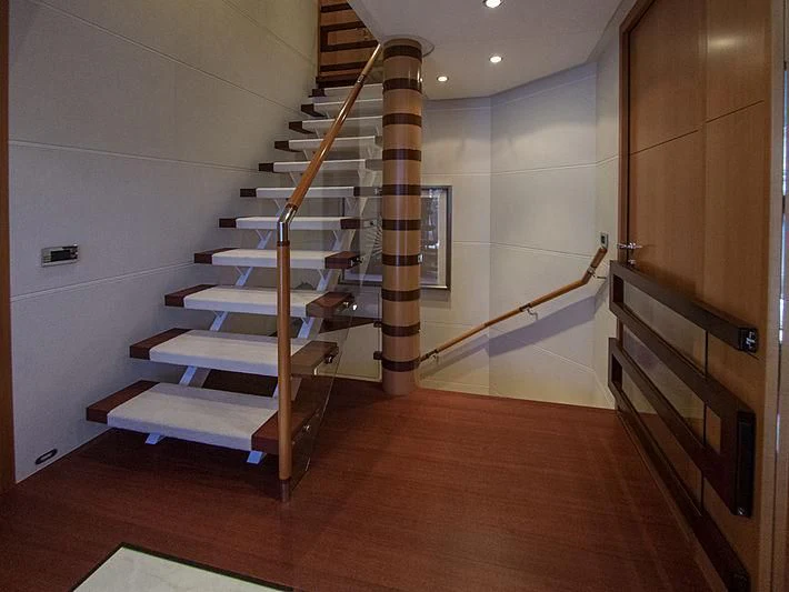 a set of stairs in a house aboard SHARKFINN Yacht for Sale