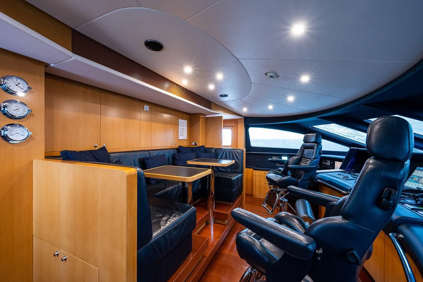 a room with chairs and tables aboard SHARKFINN Yacht for Sale