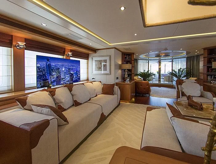 a living room with a large window aboard SHARKFINN Yacht for Sale