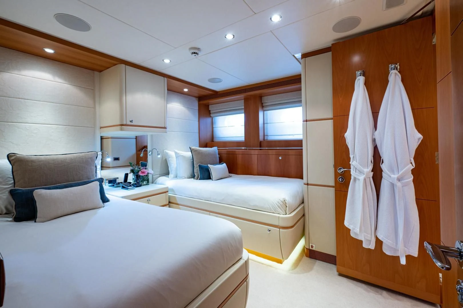 a room with a bed and a chair aboard SHARKFINN Yacht for Sale