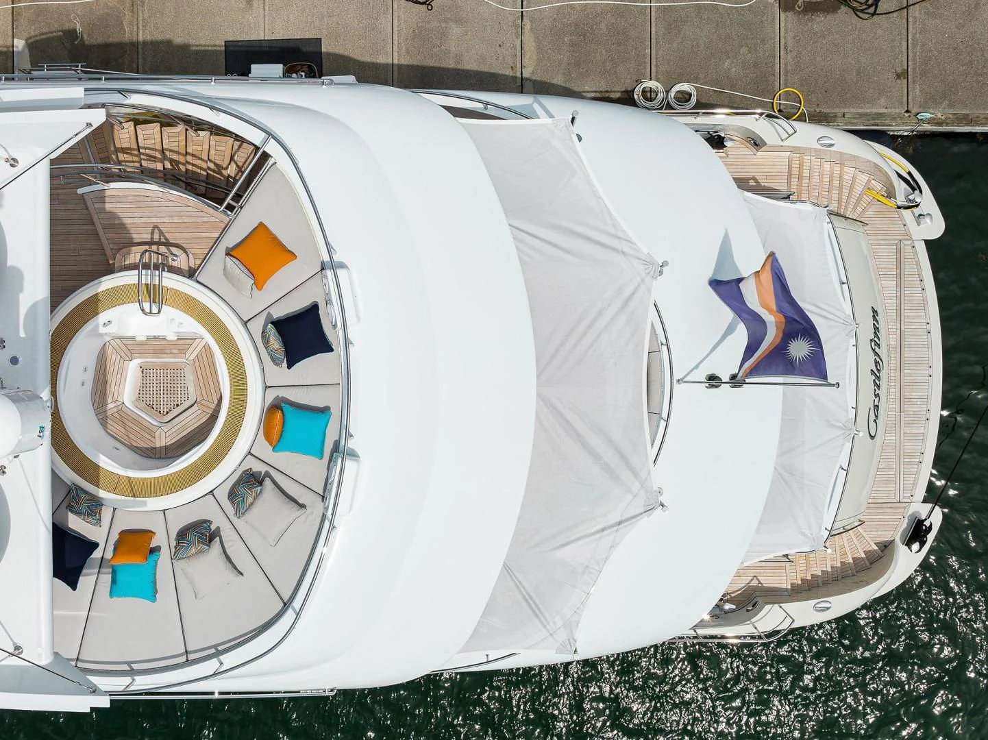 a white tent with a blue and red logo on it aboard SHARKFINN Yacht for Sale