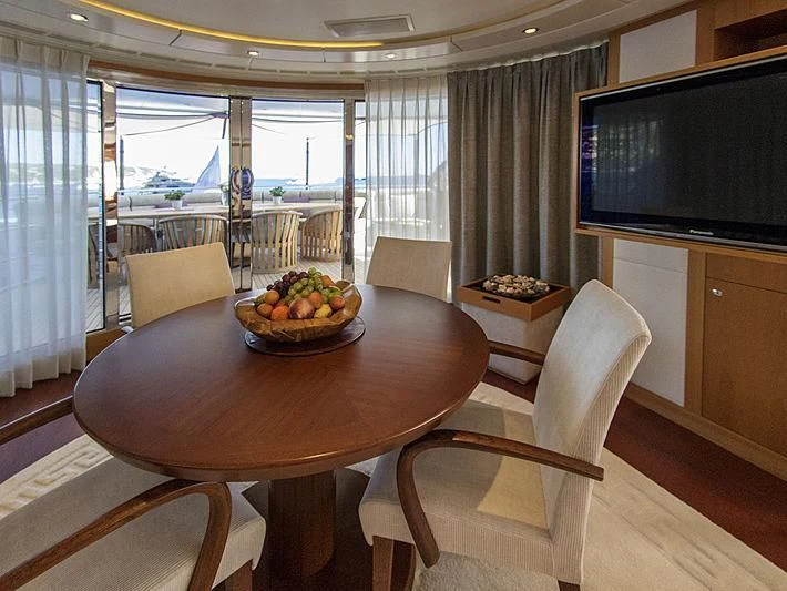 a table with a bowl of fruit on it aboard SHARKFINN Yacht for Sale