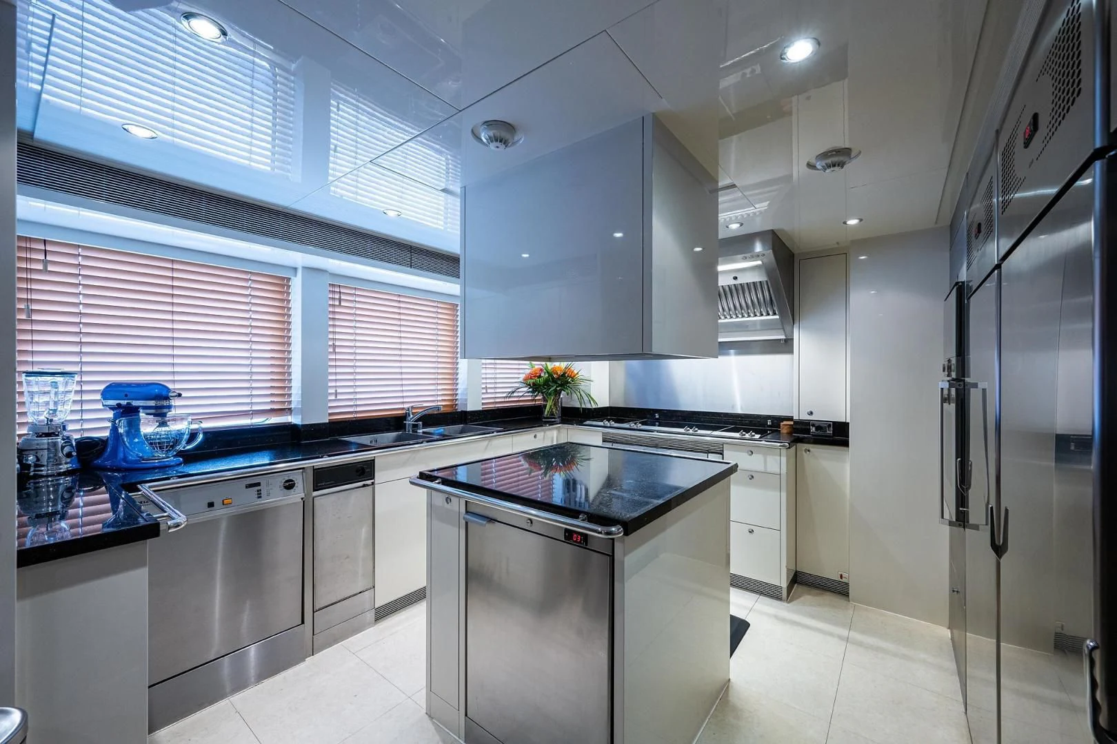 a kitchen with white cabinets aboard SHARKFINN Yacht for Sale