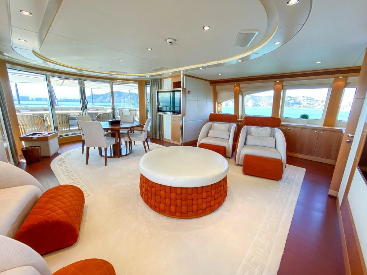 a room with a table and chairs aboard SHARKFINN Yacht for Sale