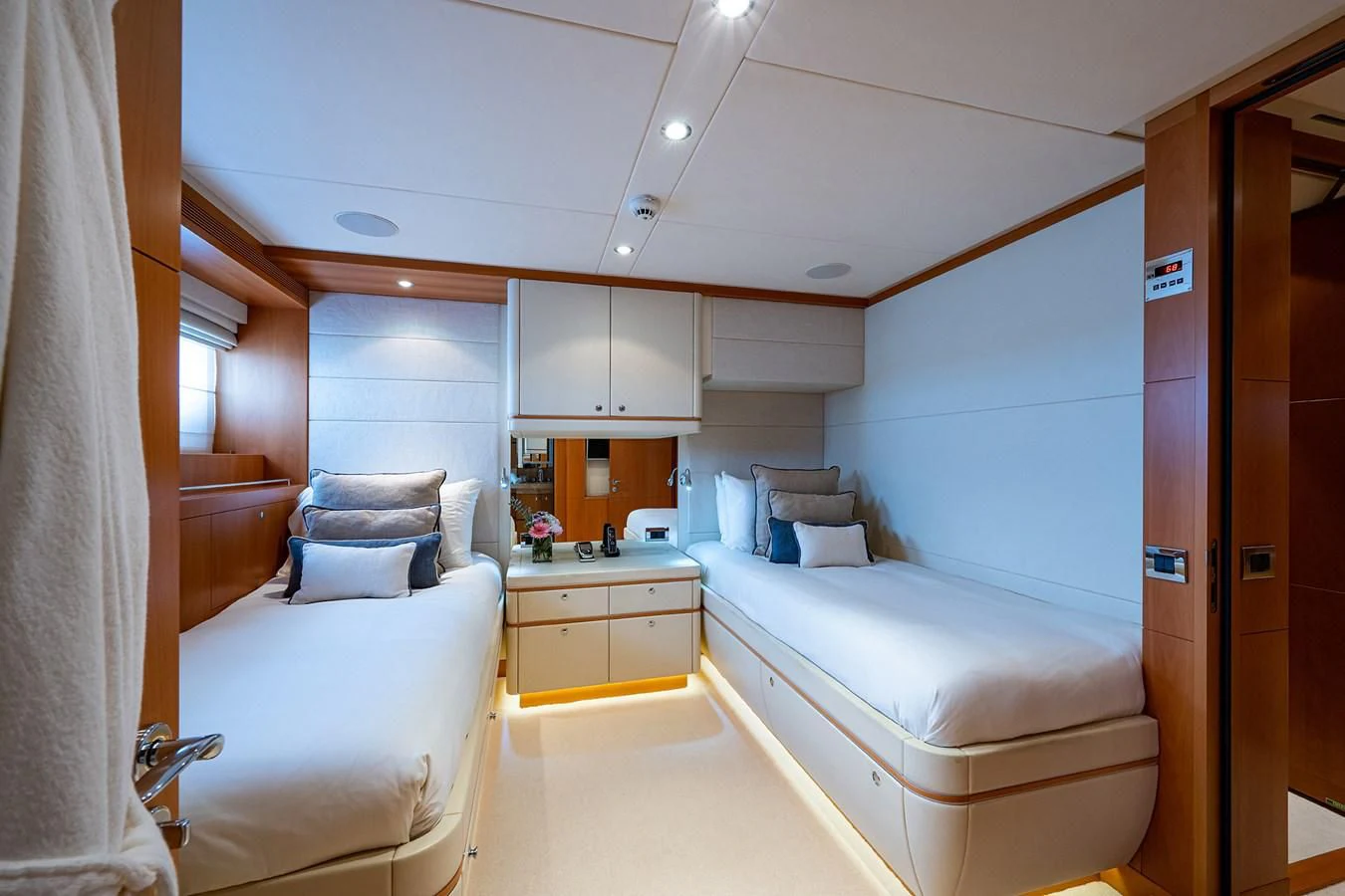 a room with a bed and a desk aboard SHARKFINN Yacht for Sale