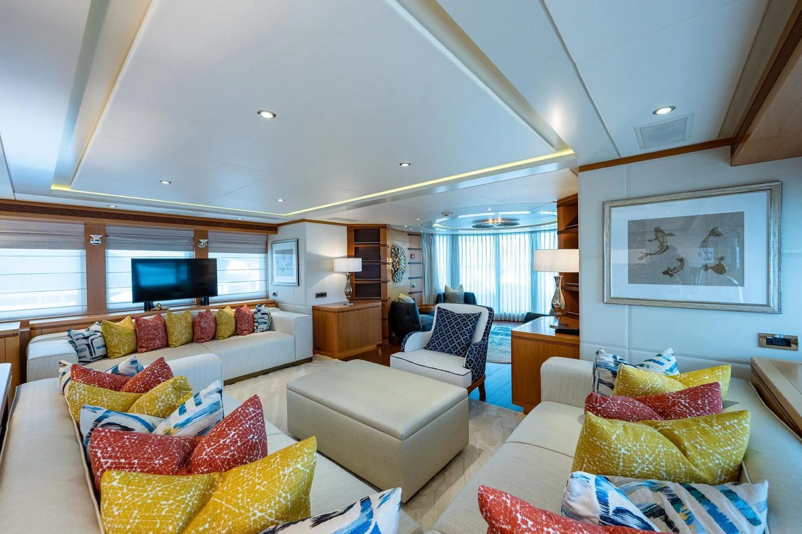 a living room with a couch and a television aboard SHARKFINN Yacht for Sale