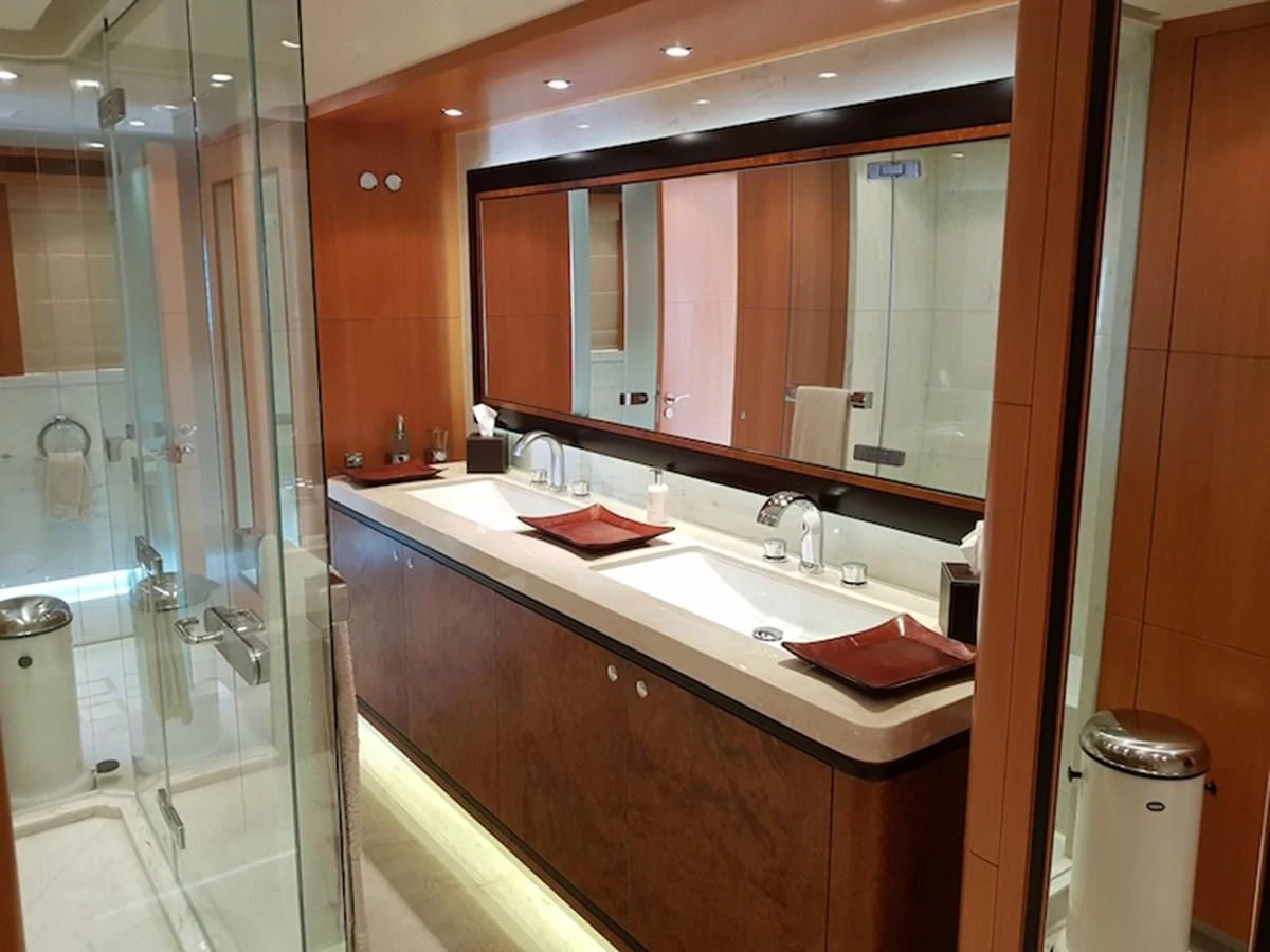 a bathroom with a glass shower aboard SHARKFINN Yacht for Sale