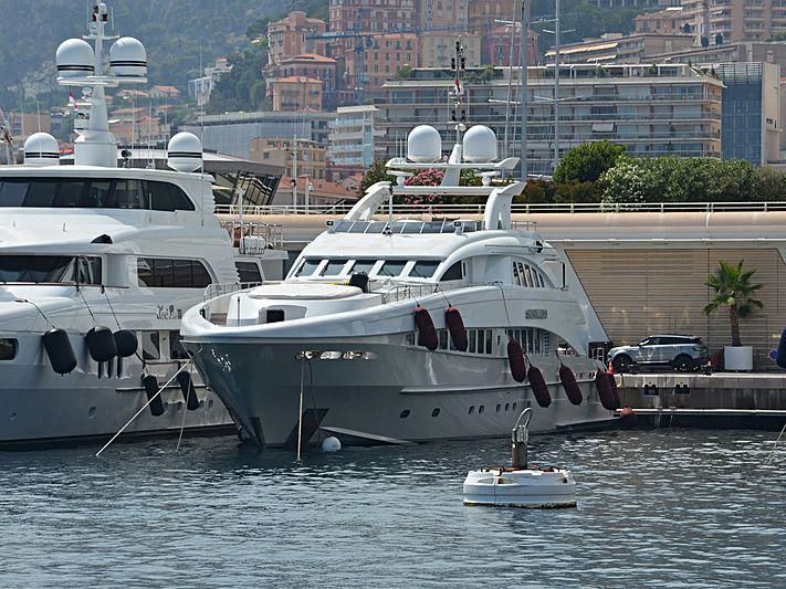 a couple of boats are parked in the water aboard SHARKFINN Yacht for Sale