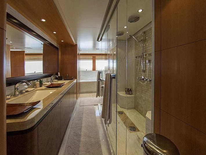a bathroom with a glass shower aboard SHARKFINN Yacht for Sale