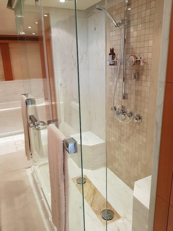 a shower with a glass door aboard SHARKFINN Yacht for Sale