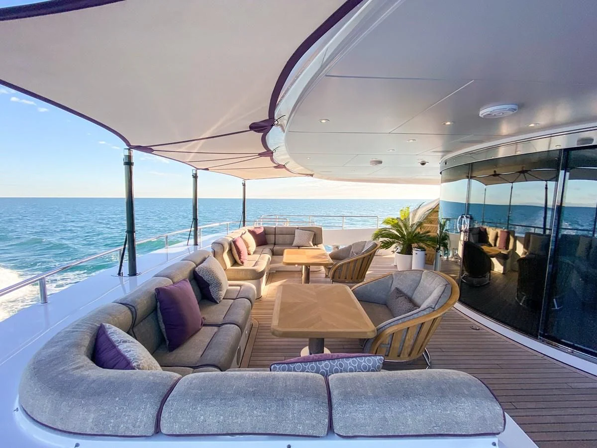 a large living room with a large body of water aboard SHARKFINN Yacht for Sale