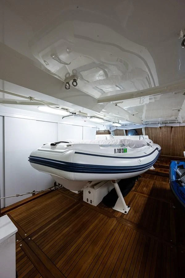 a boat on a wooden deck aboard SHARKFINN Yacht for Sale