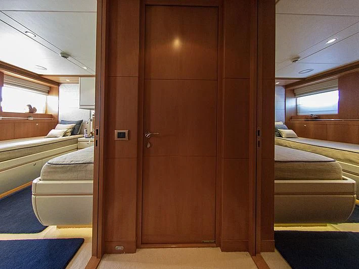 a room with a wood door aboard SHARKFINN Yacht for Sale