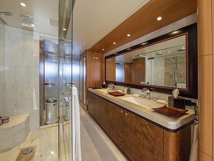 a bathroom with a large mirror aboard SHARKFINN Yacht for Sale