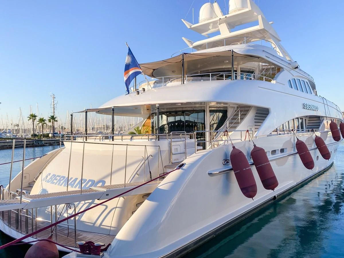 a boat docked at a pier aboard SHARKFINN Yacht for Sale