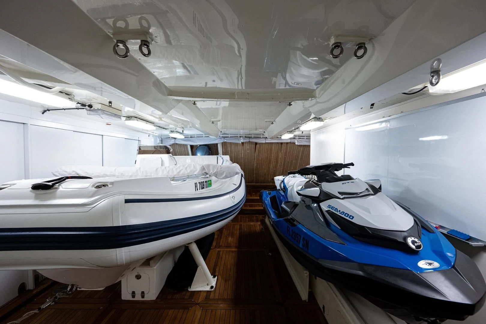 a couple of boats in a room aboard SHARKFINN Yacht for Sale