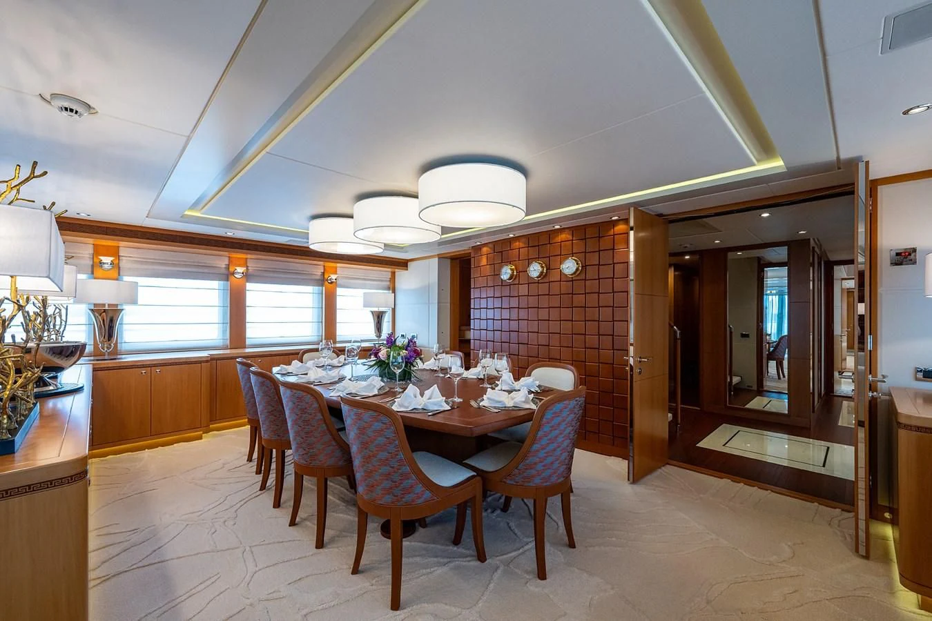 a dining room with a table and chairs aboard SHARKFINN Yacht for Sale