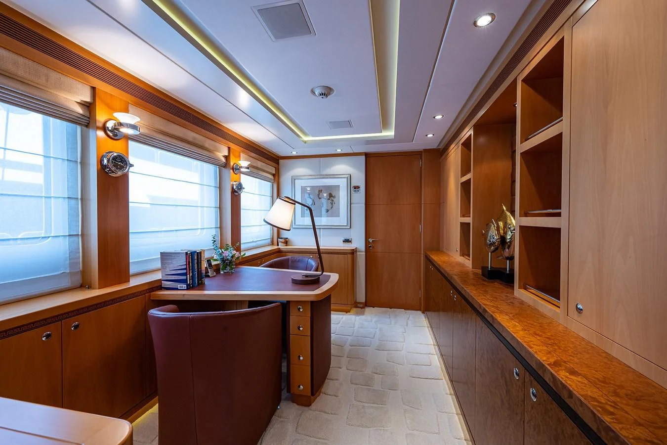 a kitchen with wooden cabinets aboard SHARKFINN Yacht for Sale
