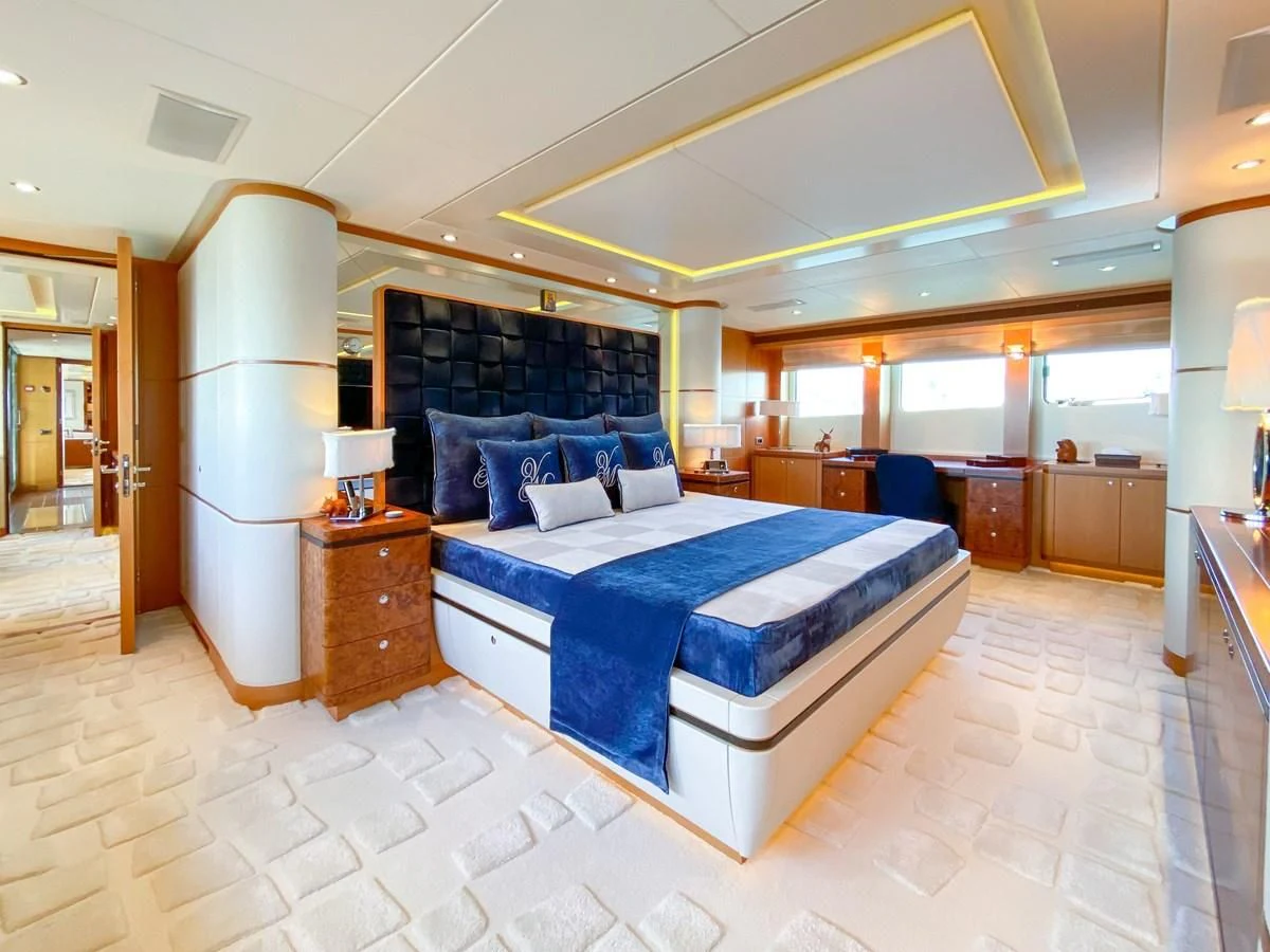 a large bedroom with a bed aboard SHARKFINN Yacht for Sale
