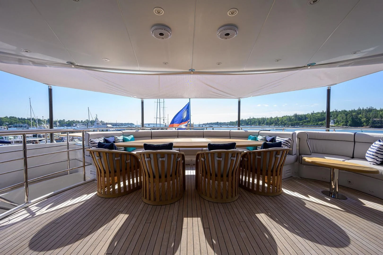 a room with tables and chairs aboard SHARKFINN Yacht for Sale