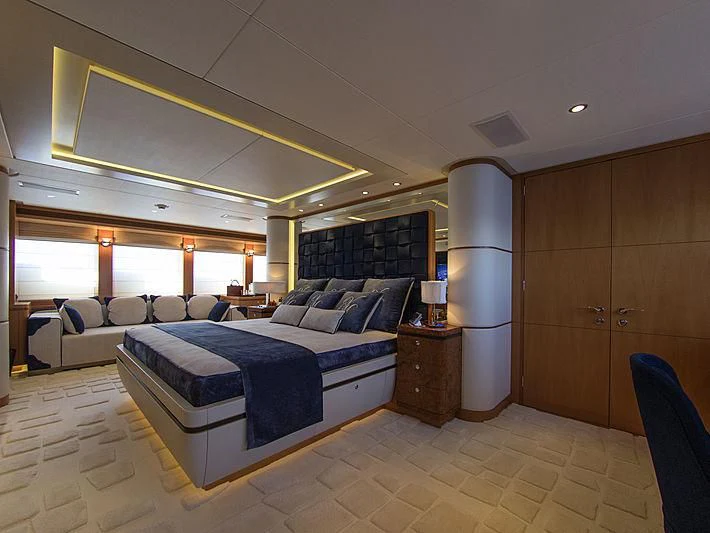 a large bedroom with a bed aboard SHARKFINN Yacht for Sale
