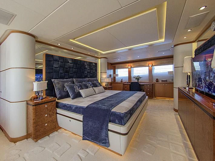 a large bedroom with a large bed aboard SHARKFINN Yacht for Sale