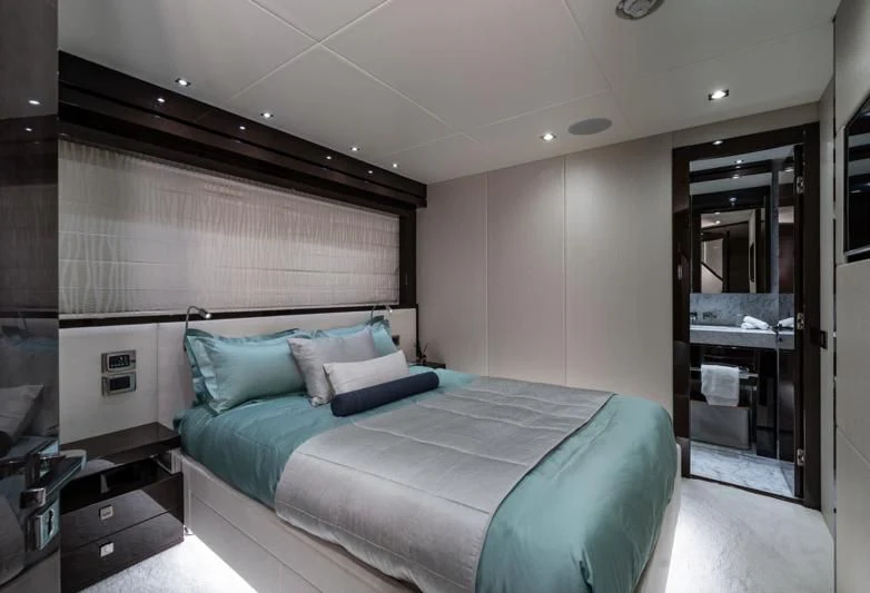 a bed in a room aboard LADY M Yacht for Sale