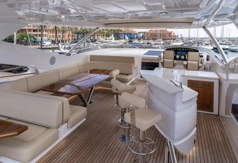 a room with a table chairs and a large window aboard LADY M Yacht for Sale